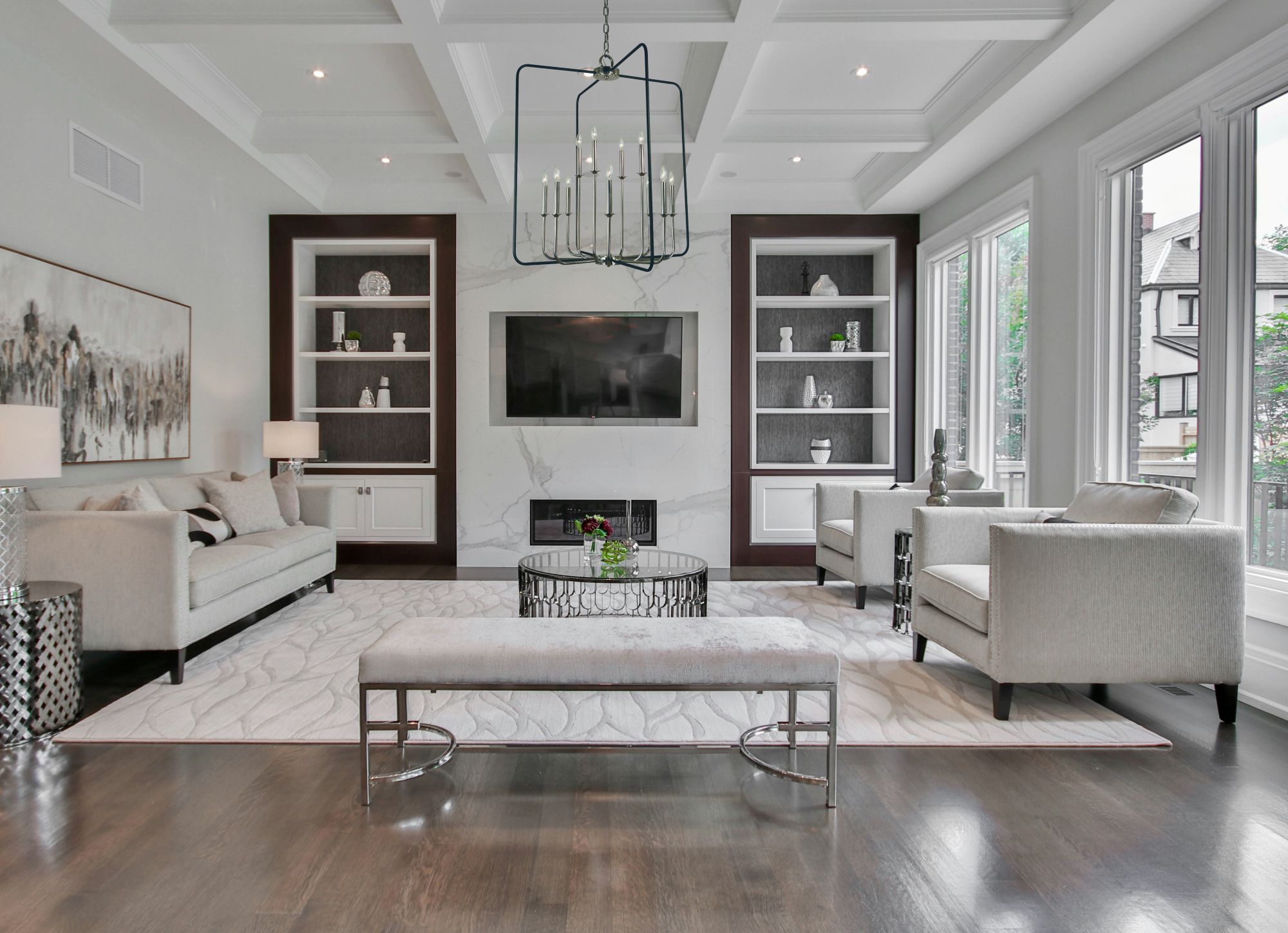 Framburg artisan wall sconces and chandelier in a classic American interior setting